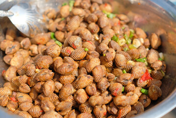 Fresh and delicious soft-boiled blood cockles shell served with spicy sauce