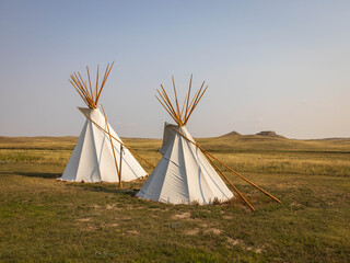 Close-up shot of beautiful two teepees under the sky