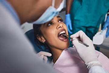 Its time to start smiling again. Shot of a young woman having dental work done on her teeth.