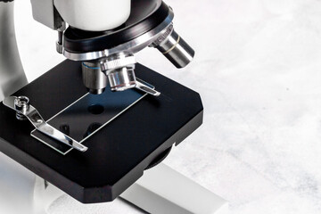 Lens of microscope close up. Research in scientific medical laboratory
