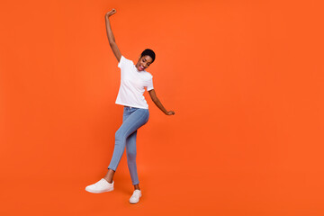 Fototapeta na wymiar Full size photo of stylish trendy androgyne lady dance dynamic hands up copyspace isolated bright color background