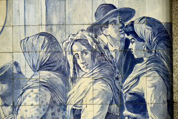 panels of azulejos represent the miraculous fountain in the Sao Bento railway station, Porto,...