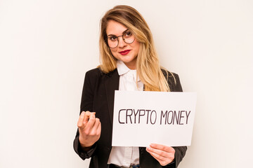 Young business caucasian woman holding a crypto money placard isolated on white background pointing with finger at you as if inviting come closer.