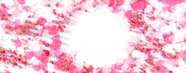 Valentine day panorama with a frame of pink hearts and flowers confetti, a flat lay panoramic banner on a white background with a place for text