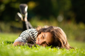 attractive young woman relaxing in park
