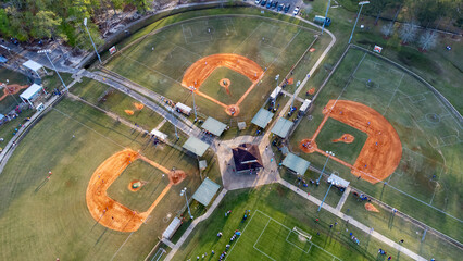 Aerial shot of soccer and baseball fields with trees around