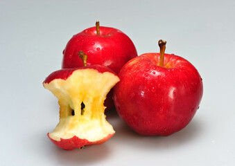  Close-up of a bitten red apple on a white background