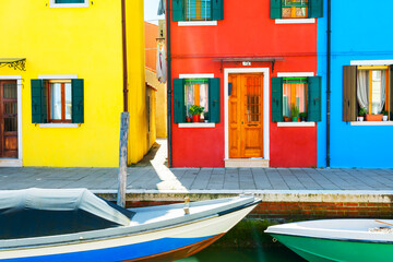 Fototapeta na wymiar Scenic canal with colorful buildings in Burano island, Venice, Italy