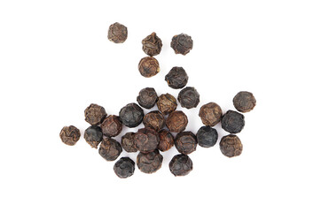 pile of black pepper seeds. isolated white background