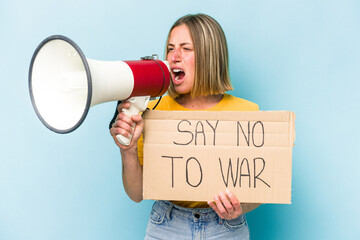 Young caucasian woman holding say no war placard isolated on blue background