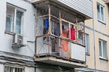 View of Khrushchyovka's balcony. Khrushchyovka is common type of old low-cost apartment building in...