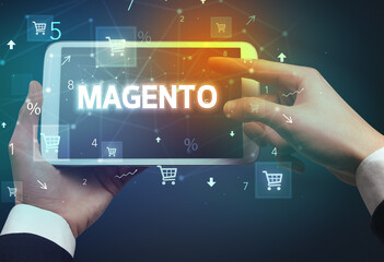 Close-up of a hand holding tablet with shopping inscription