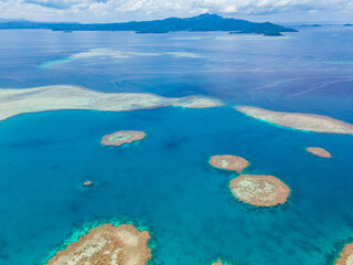 Beautiful drone aerial view of Mayotte lagoon, coral reef and island