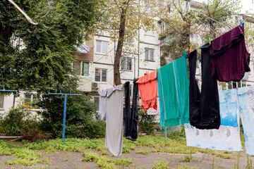 Laundry dries on the rope in courtyard of Khrushchyovka. Khrushchyovka is common type of old low-cost apartment building in Russia and post-Soviet space. Household concept. Russia, Vladivostok.