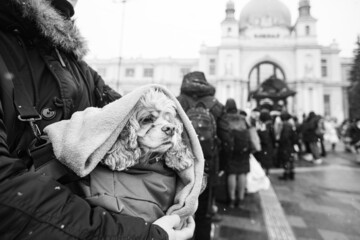 Ukrainian refugees on Lviv railway station waiting for train to escape to Europe