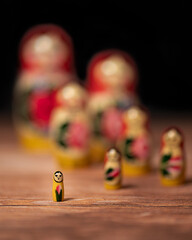 Selective focus of stacking dolls (Matryoshka) on a wooden surface