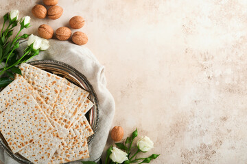 Passover celebration concept. Matzah, red kosher walnut and spring beautiful rose flowers.....