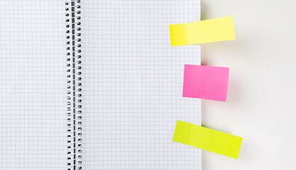 Checked notepad sheet with memo stickers, text and design