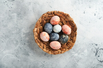 Easter eggs. Dyed Easter eggs with marble stone effect ref and blue color in rustic style on light...