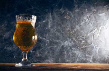 Glass of beer  in a rustic style with a place for text.