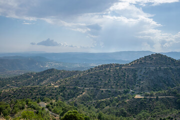 Fototapeta na wymiar Beautiful view of the open spaces of the mountains of Cyprus with green trees