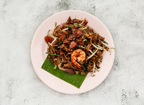 Top Shot Of A Tropical Dish With Seafood Served With Banana Leaf On The Plate.