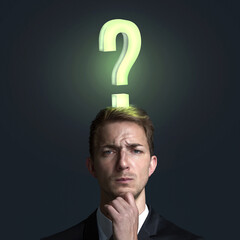 Man with a glowing Question Mark on his Head