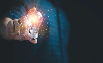 Businessman hand holding lightbulb with glowing light to creative smart thinking for inspiration and innovation with network concept.