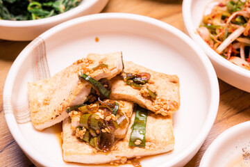 Spicy Kimchi. Korean pickle or Pickled radish vegetables and seasoning on bowl on wood table background, Japanese food