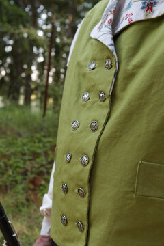 Closeup Shot Of A Man's Green Suit Jacket With Double Buttons