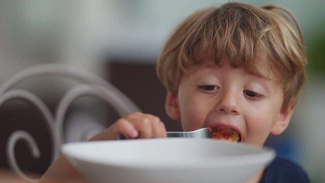 Little Boy Eating Pasta Blowing On Hot Food Kid Eats Ravioli