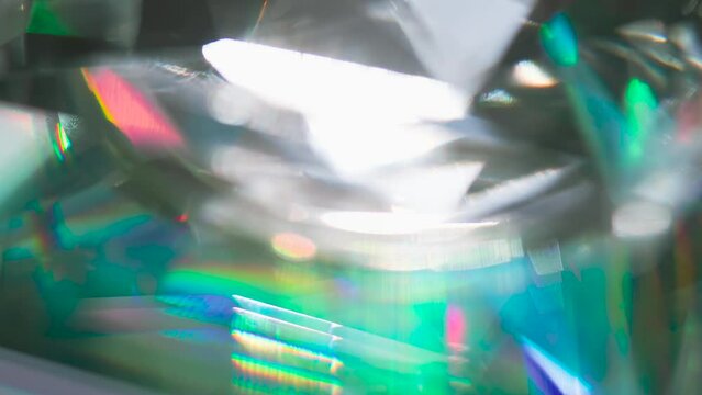 Prismatic Play of Light. Bright, iridescent reflections inside a faceted diamond. Facets create light diffraction and refraction