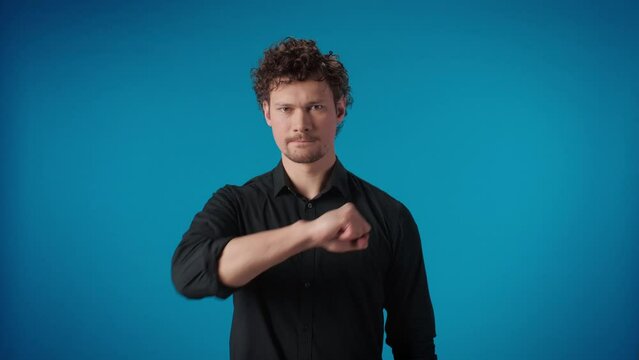 Portrait modern curly man hitting yourself into chest powerful endurance justice gesture
