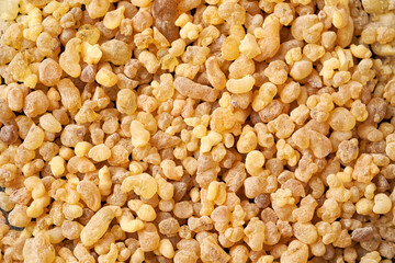Background made of frankincense or boswellia resin, with copy space