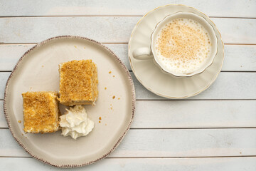 Sweet cake and coffee on the table