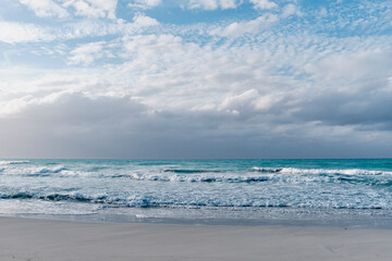 Fototapeta na wymiar Scenic dramatic seascape.Waves, dark cloudy sky. Sandy beach of Atlantic Ocean, Varadero, Cuba
