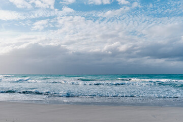 Fototapeta premium Scenic dramatic seascape.Waves, dark cloudy sky. Sandy beach of Atlantic Ocean, Varadero, Cuba