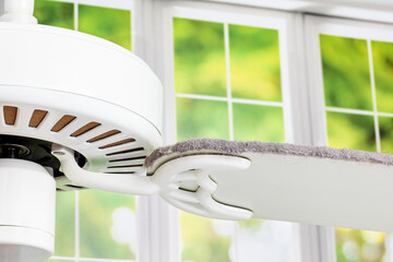 Dirty ceiling fan blade. Housekeeping, indoor allergies and spring cleaning concept