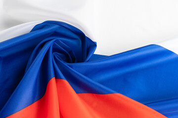 Russian flag. Folds on the satin fabric.