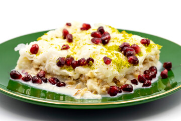 Gullac dessert (milk dessert) isolated on white background. Traditional Turkish dessert. close up