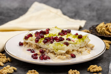 Gullac dessert ( milk dessert ) on a dark background. Traditional Turkish dessert. close up