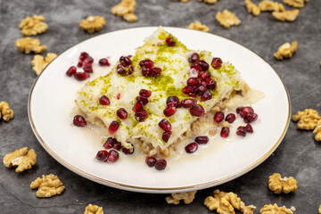 Gullac dessert ( milk dessert ) on a dark background. Traditional Turkish dessert. close up