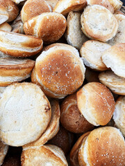 Breads called “cemita” for sale in a bread basket, along with other varieties such as “torta” breads