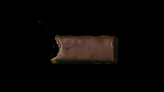 Stop motion of eating chocolate bar bite by bite, black background.