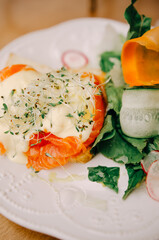 Morning breakfast with fresh toast with salmon and vegetables. Healthy food concept.