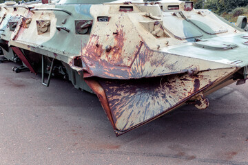 Destroyed armored personnel carrier with traces of shells hit