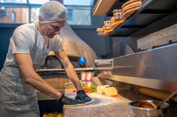 Chef working in the kitchen in the restaurant