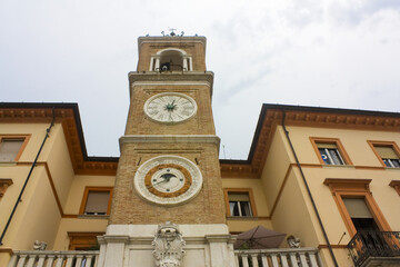 Fototapeta na wymiar Clock Tower (or Torre dell' Orologio) at Piazza Tre Martiri in Rimini, Italy