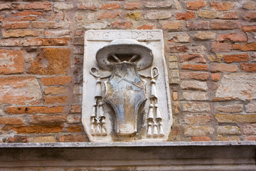 Rich decoration of old historical building in downtown of Rimini, Italy