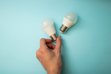White light bulb on a blue background